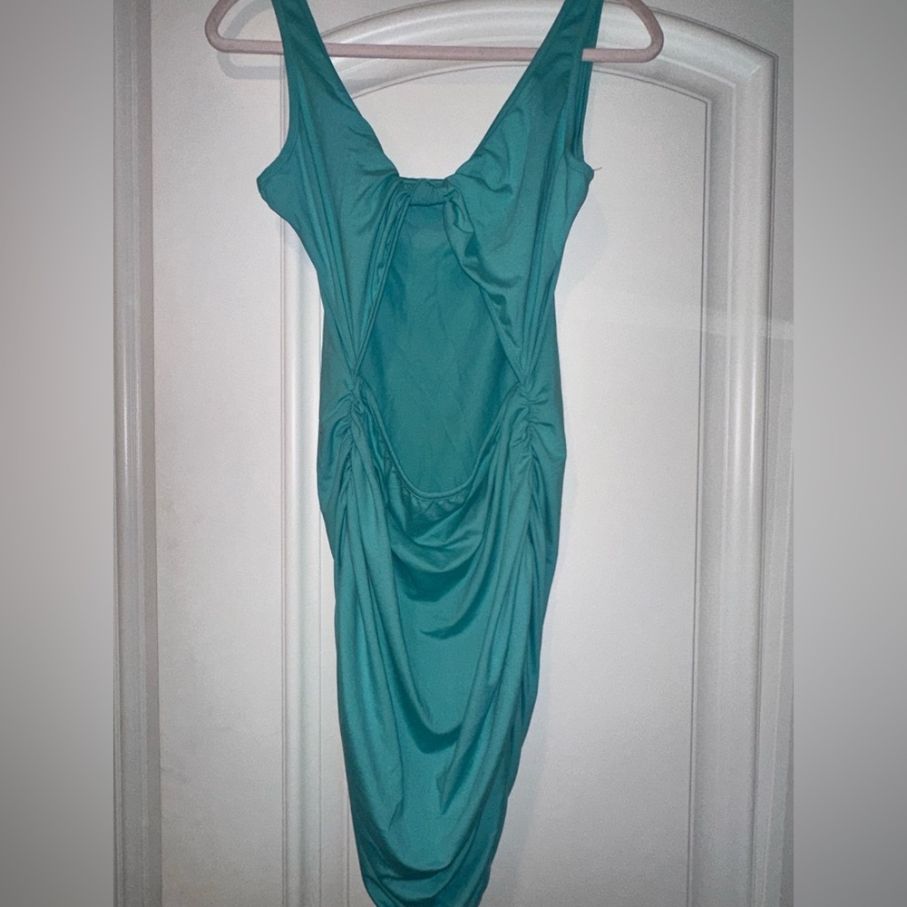 Never worn Women’s dress with opening in the stomach area